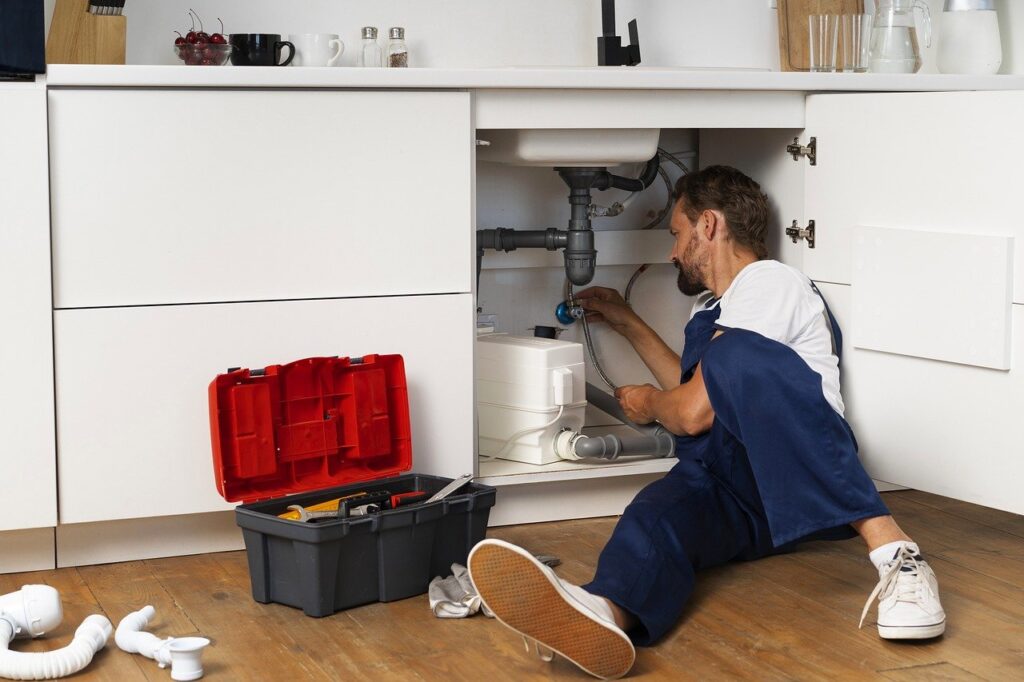 sole trader plumber under sink